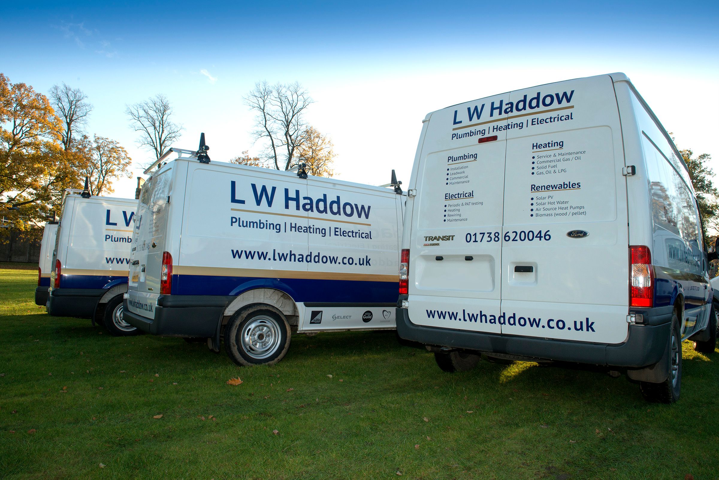 LW Haddow Plumbing and Heating van stationed, providing a vantage point for fast and reliable plumbing, heating, electrical, andces. renewable servi