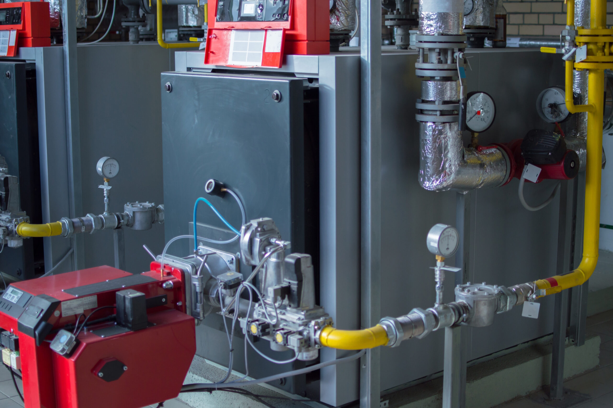 Modern industrial gas boiler installation in a plant room