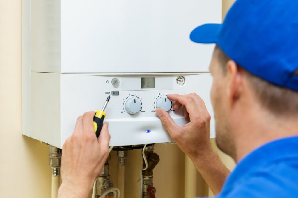 A technician performing a routine boiler maintenance check